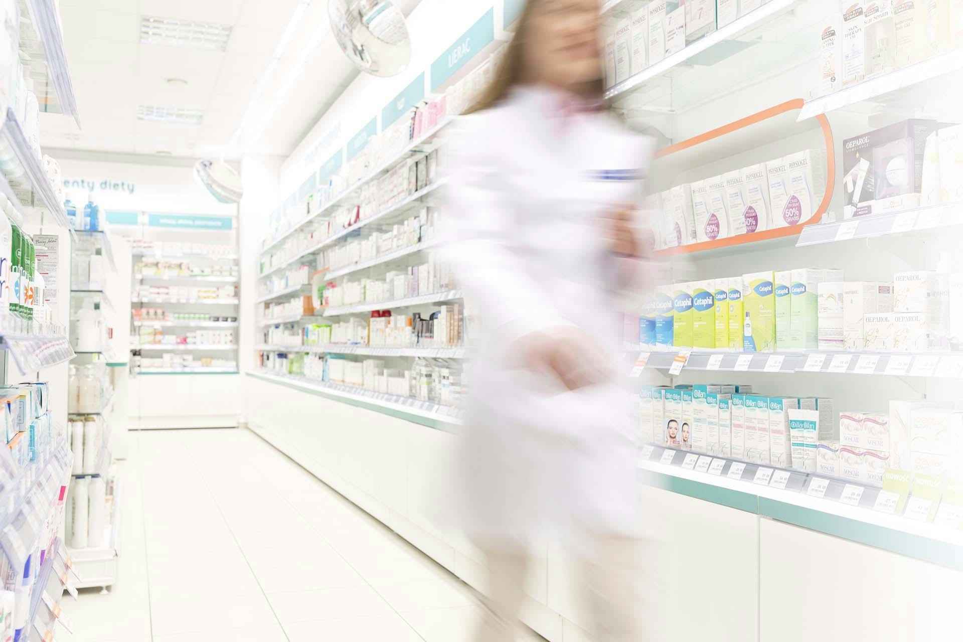 woman walking in pharmacy